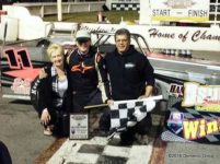 Aric Iosue in Oswego Speedway Victory Lane with parents Gail and Dave.