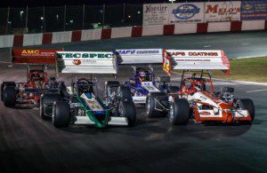 A pack of California Supermodified Series racers get ready to start a race at Madera Speedway