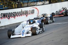 Oswego Speedway supermodifieds race into turn one